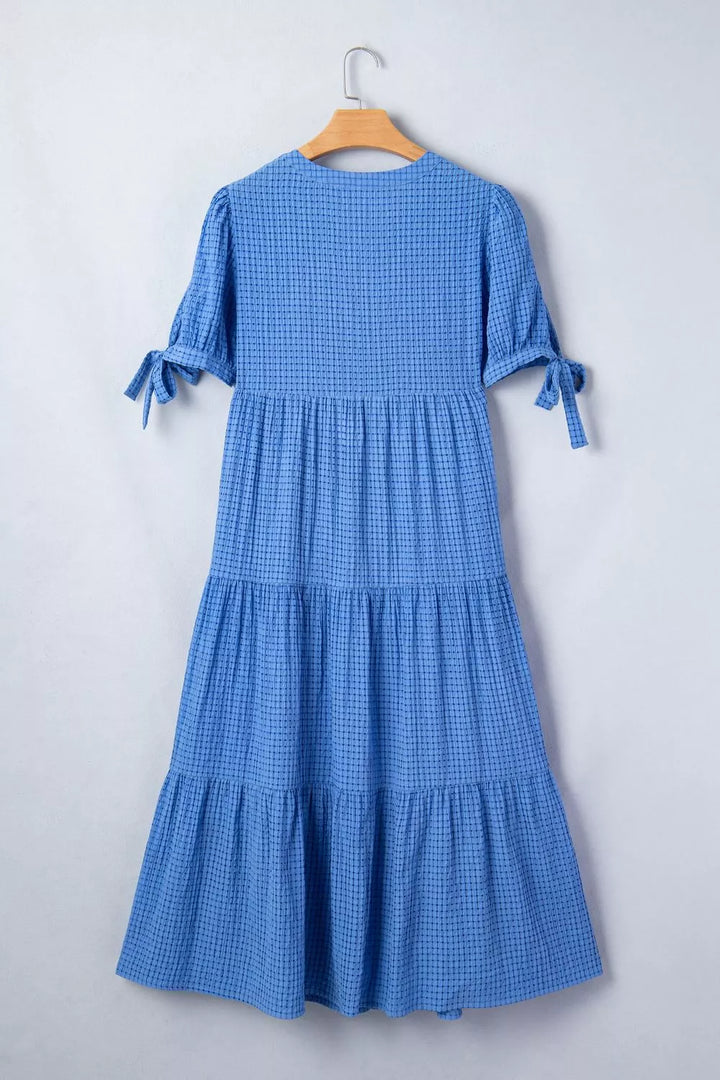 Tiered midi dress with notched neckline and tie sleeves