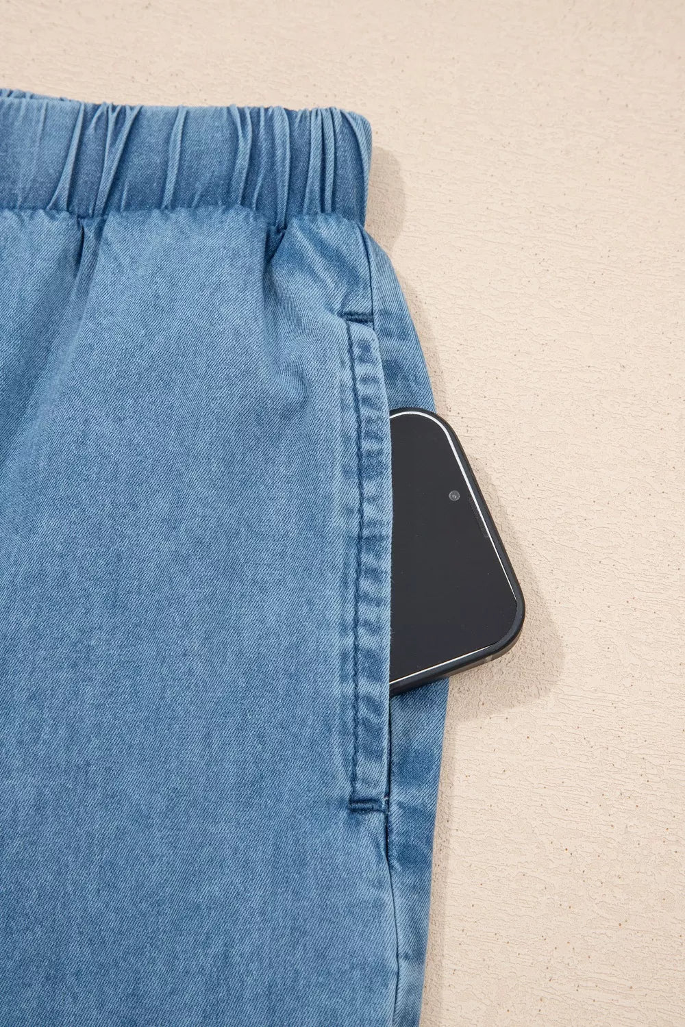 Wide-leg chambray pants with drawstring waist and ruffle hem