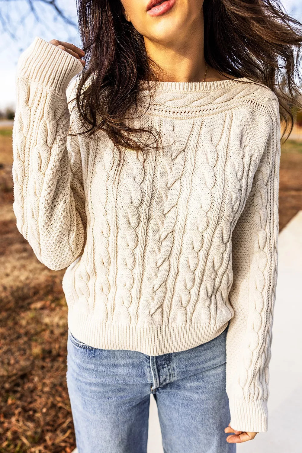 Cable knit drop shoulder sweater with ribbed cuffs