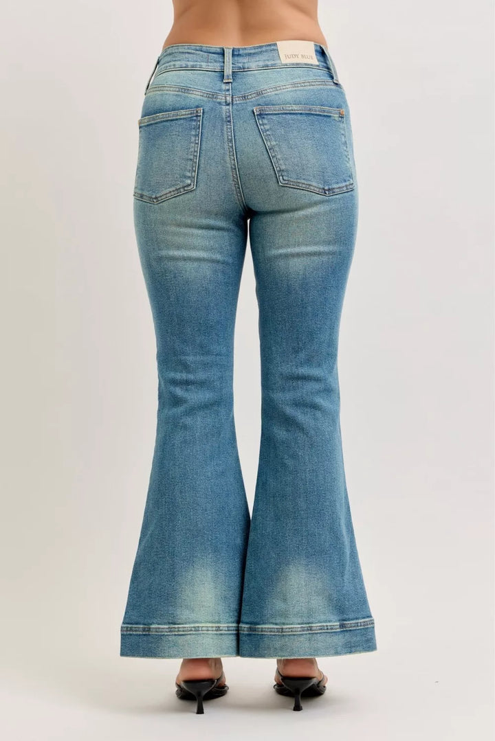 High-rise vintage wash flare jeans with released hem