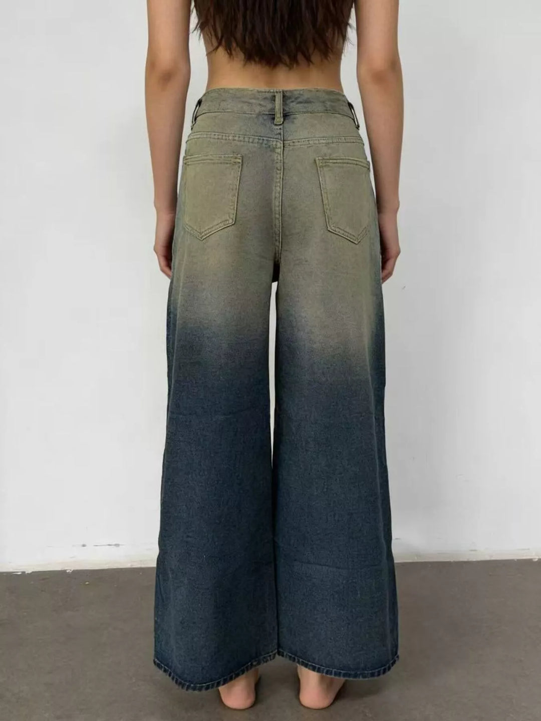 Bow-detail wide leg jeans with faded whiskering