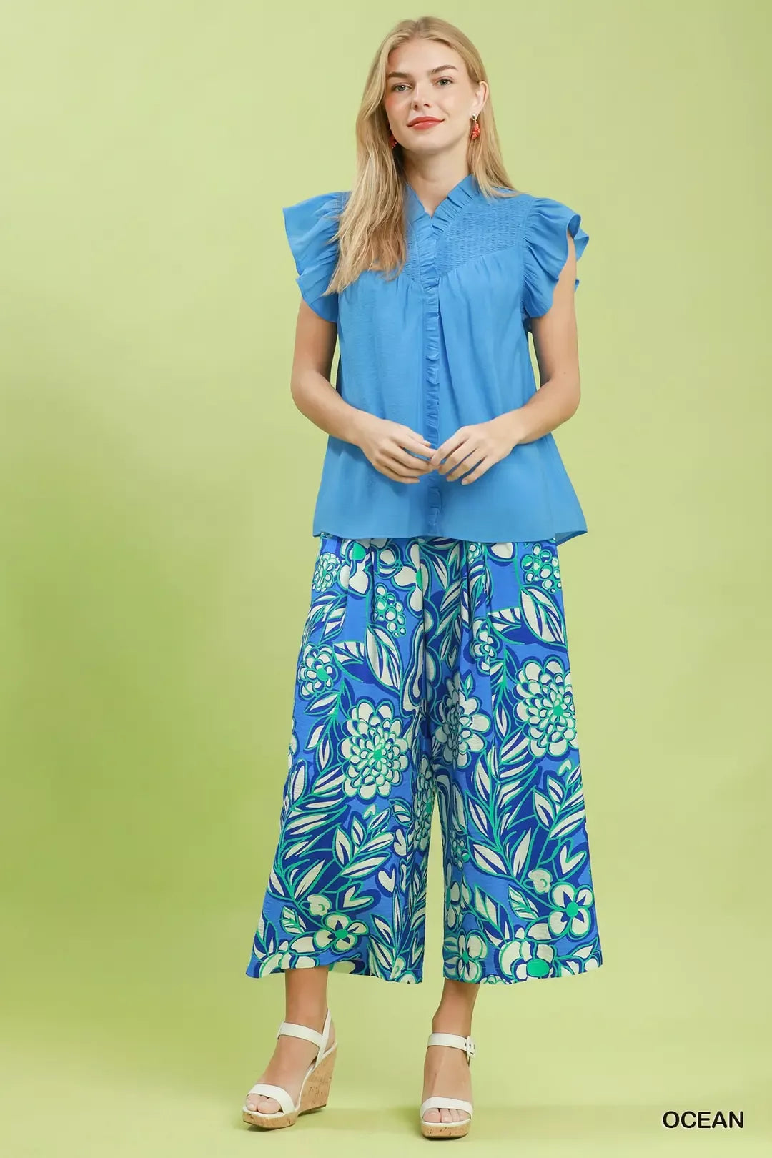 Smocked yoke flutter sleeve blouse with ruffle placket