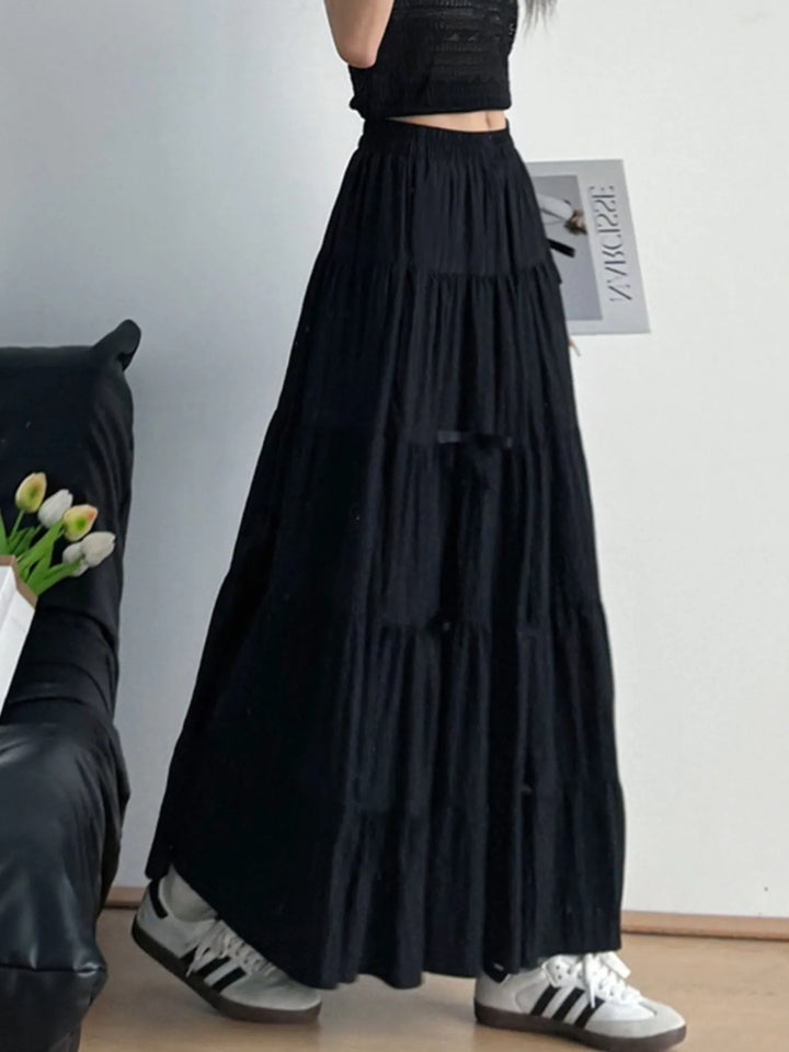Tiered bow-accent maxi skirt with elastic smocked waist