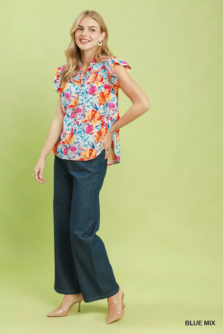 Smocked yoke floral blouse with flutter ruffle sleeves