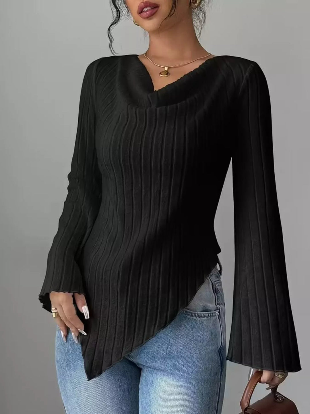 Ribbed knit top with asymmetric hem and flared sleeves