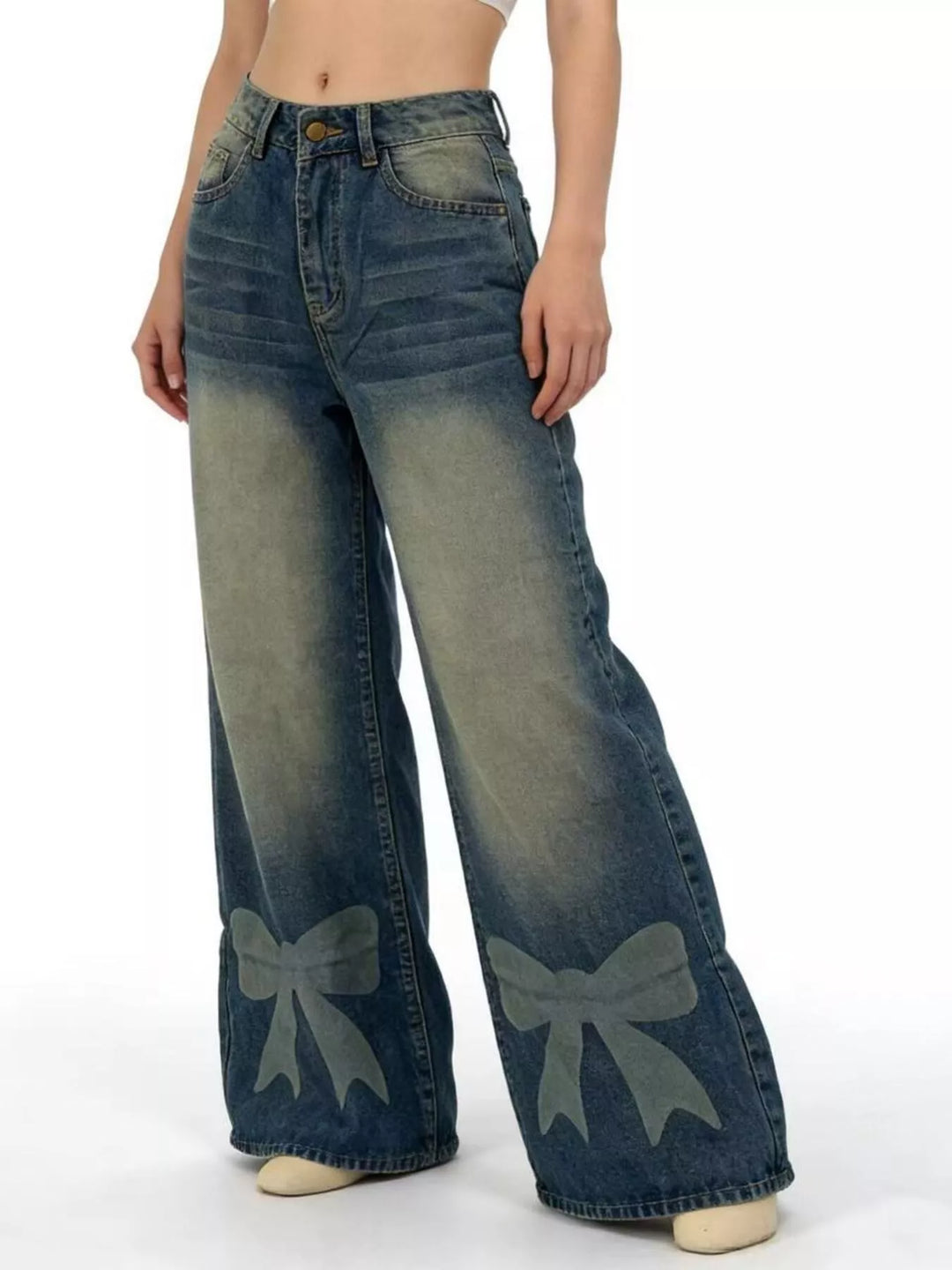 Bow-detail wide leg jeans with faded whiskering