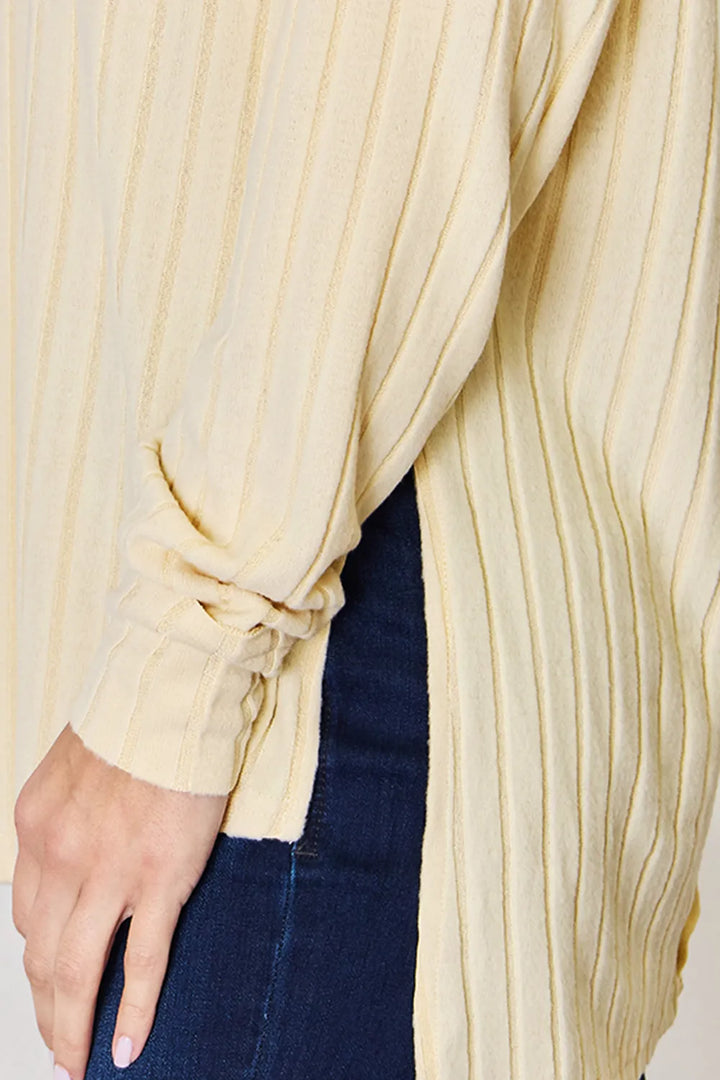 Ribbed knit round neck long sleeve top with side slits
