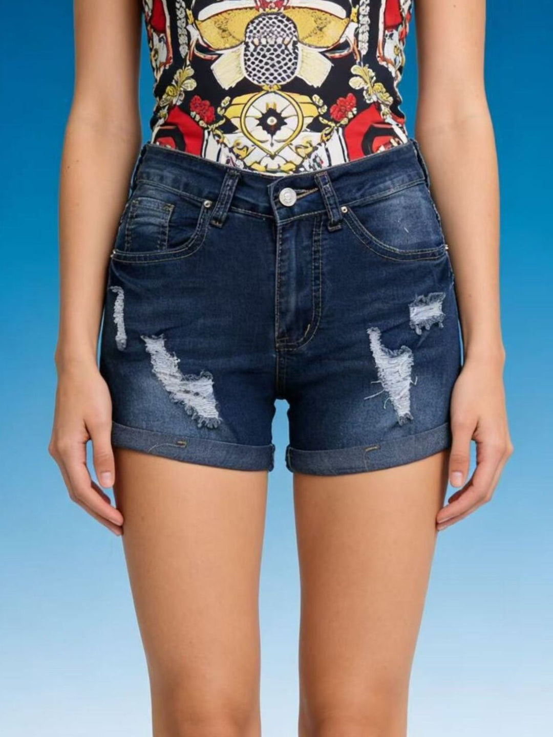 Distressed mid-rise denim shorts with cuffed hem