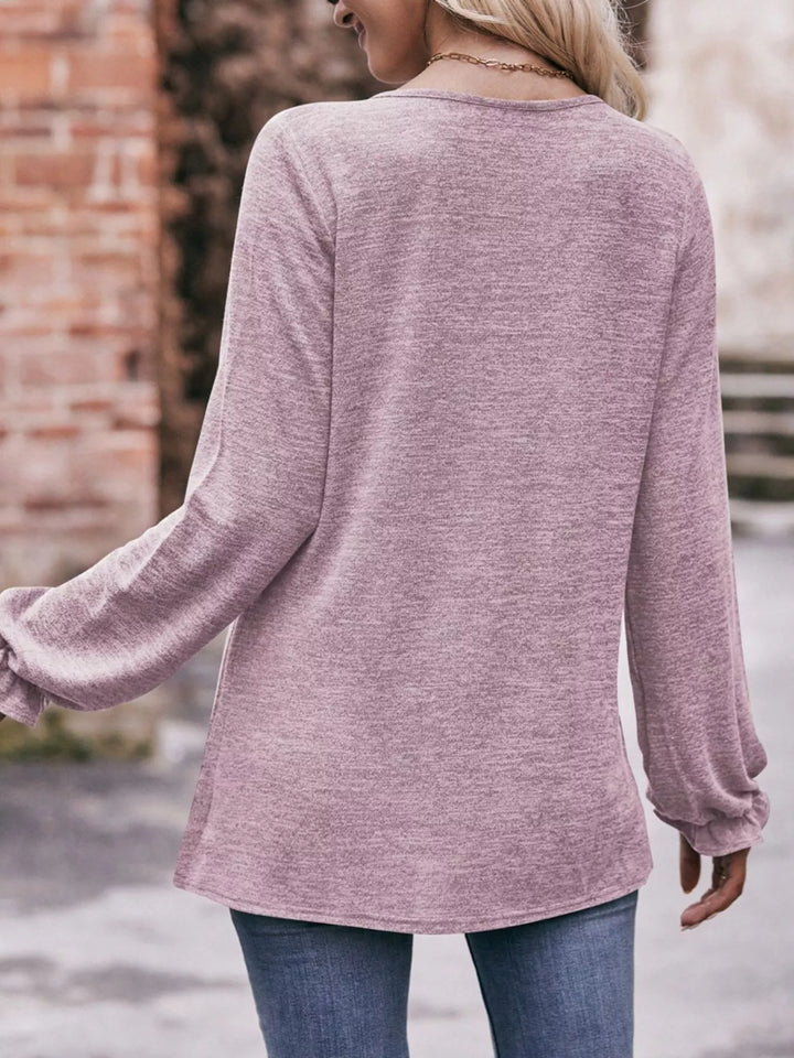 Ruffle cuff long sleeve top with pleated neckline