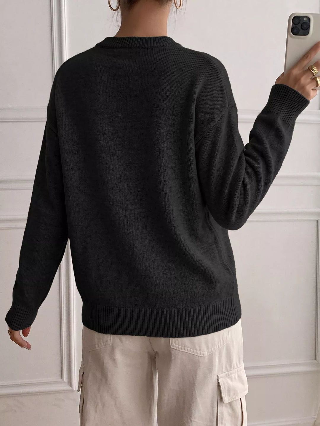 Three-button henley placket knit sweater with ribbed trim