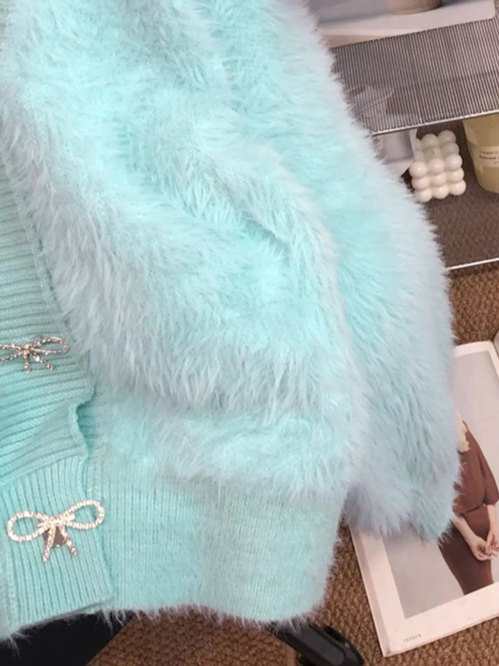 Fuzzy knit cropped cardigan with rhinestone bow buttons