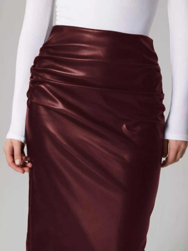 High-rise faux leather midi pencil skirt with back slit