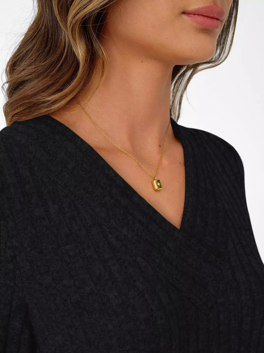 Ribbed knit v-neck top with blouson sleeves