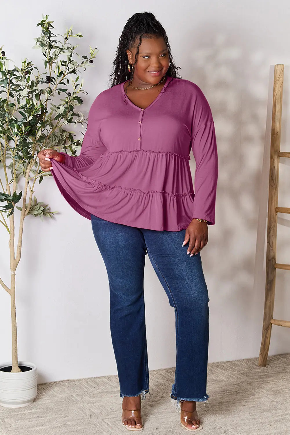 Half-button long sleeve blouse with tiered ruffle hem