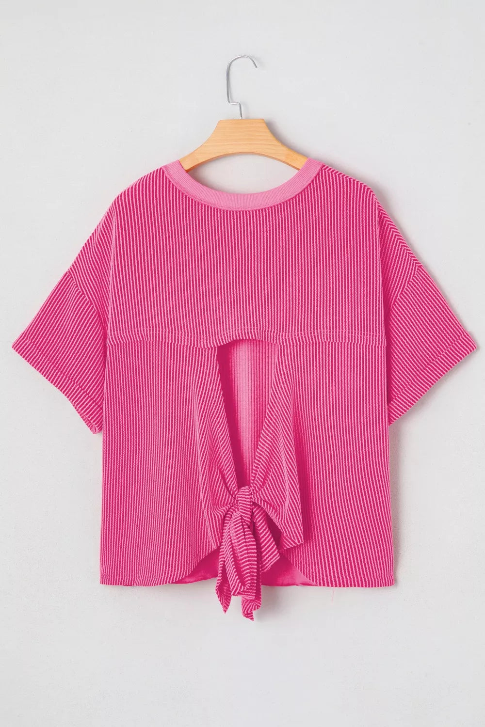 Ribbed knit short sleeve top with cutout bow-tie back