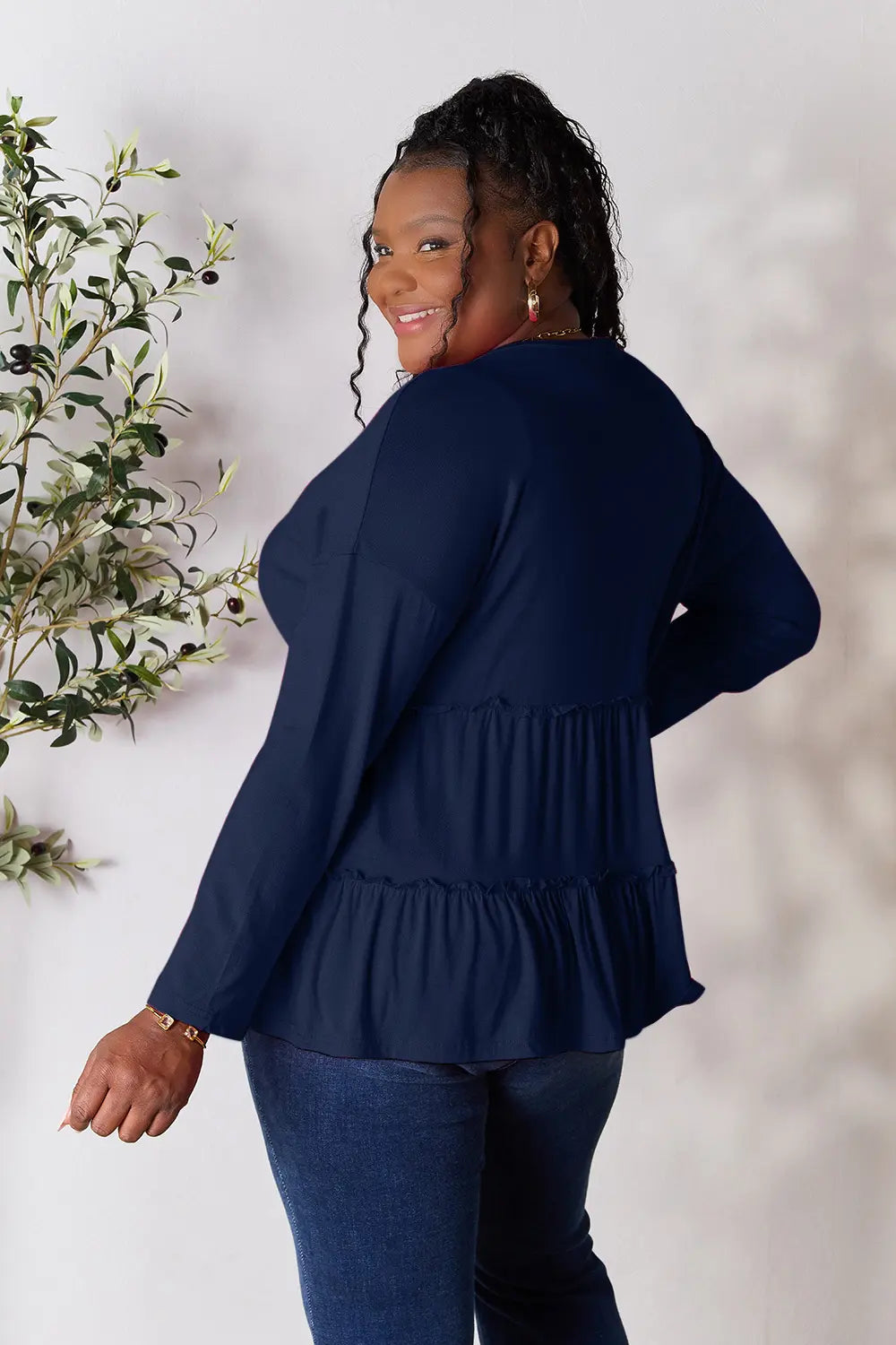 Half-button long sleeve blouse with tiered ruffle hem