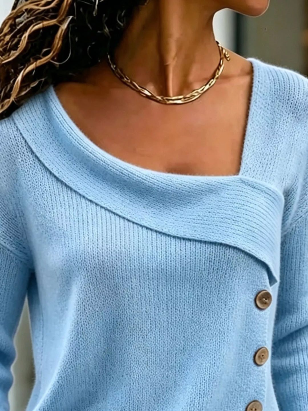 Asymmetrical button sweater with angled ribbed neckline