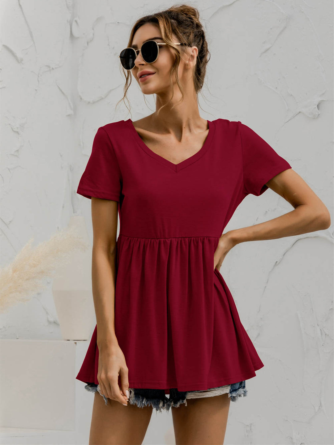 V-neck babydoll top with short sleeves and empire waist