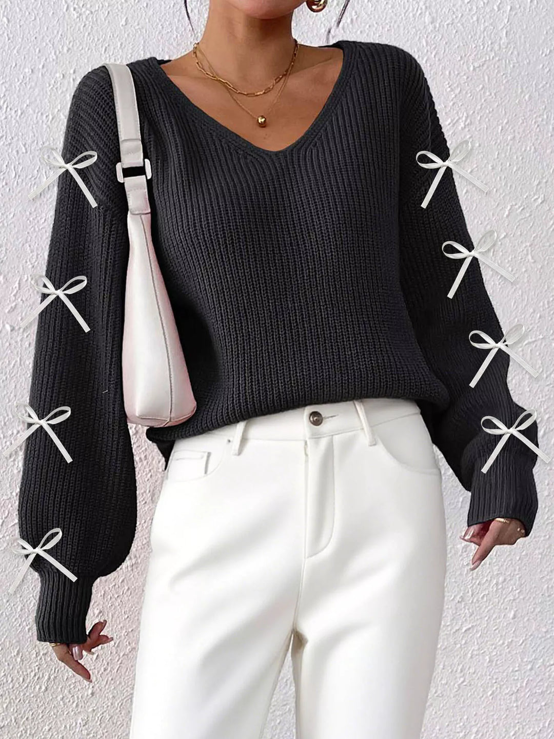 Ribbed knit V-neck sweater with bow-tie sleeves