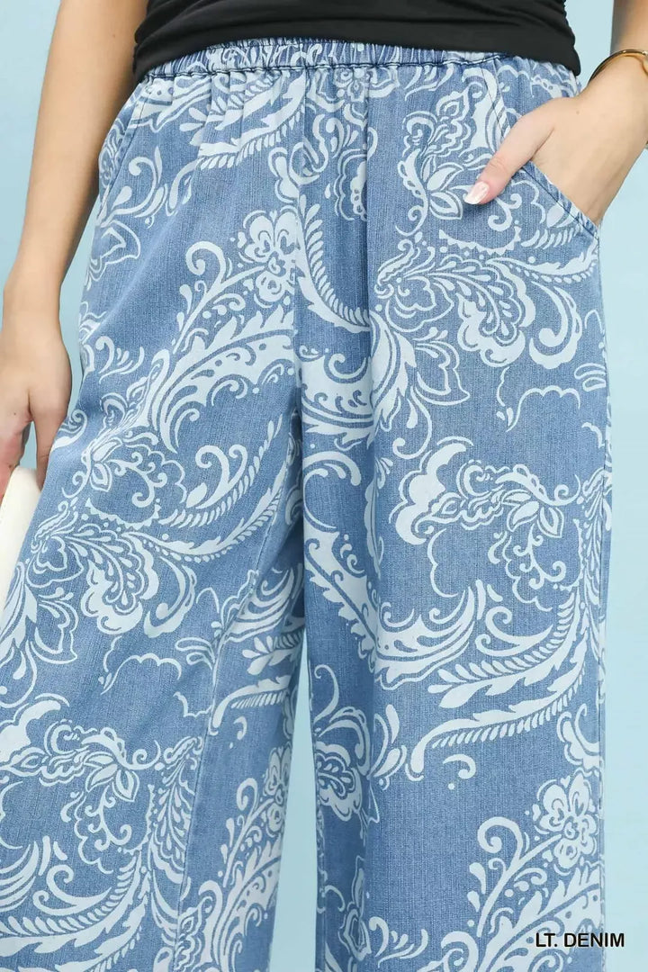 Stone wash floral wide leg crop pants with frayed hem