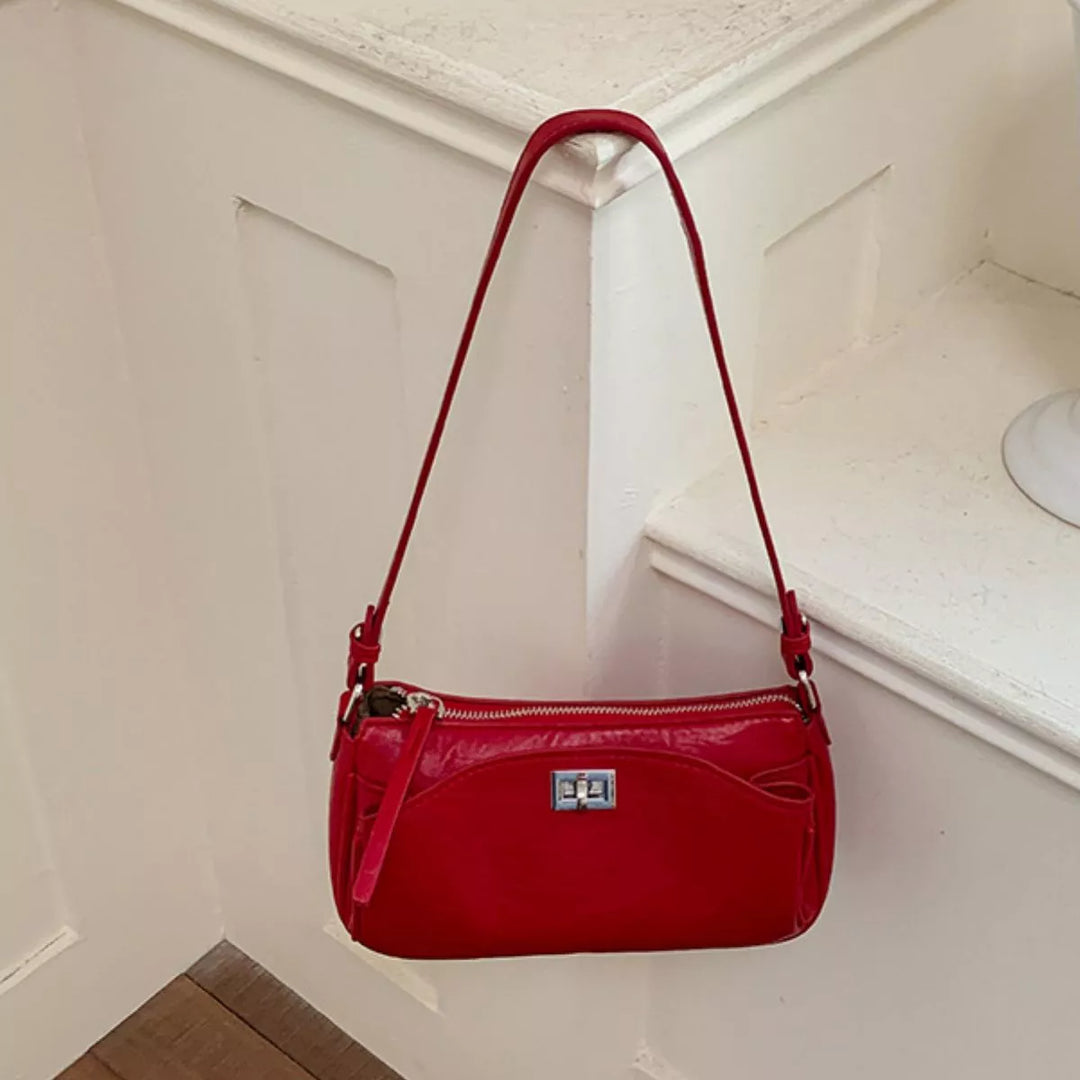 Faux leather baguette shoulder bag with twist lock