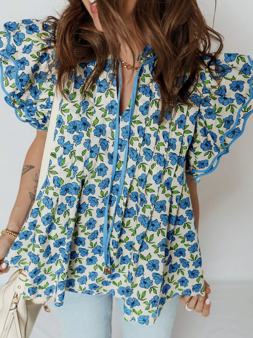 Floral ruffle flutter sleeve tie-neck blouse