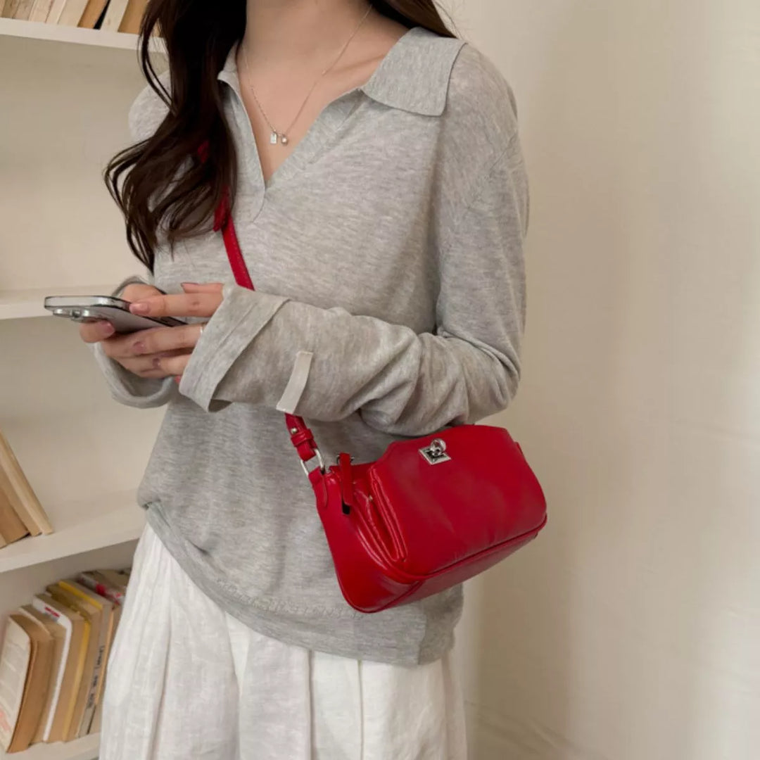 Faux leather baguette shoulder bag with twist lock