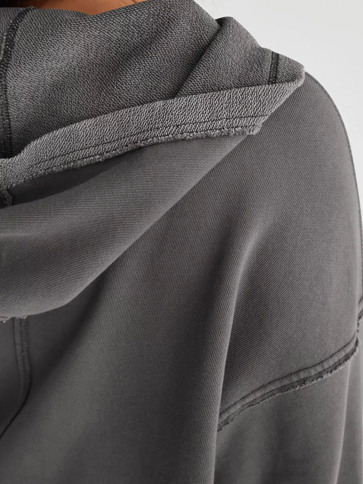 Cropped exposed-seam pullover hoodie with split neck