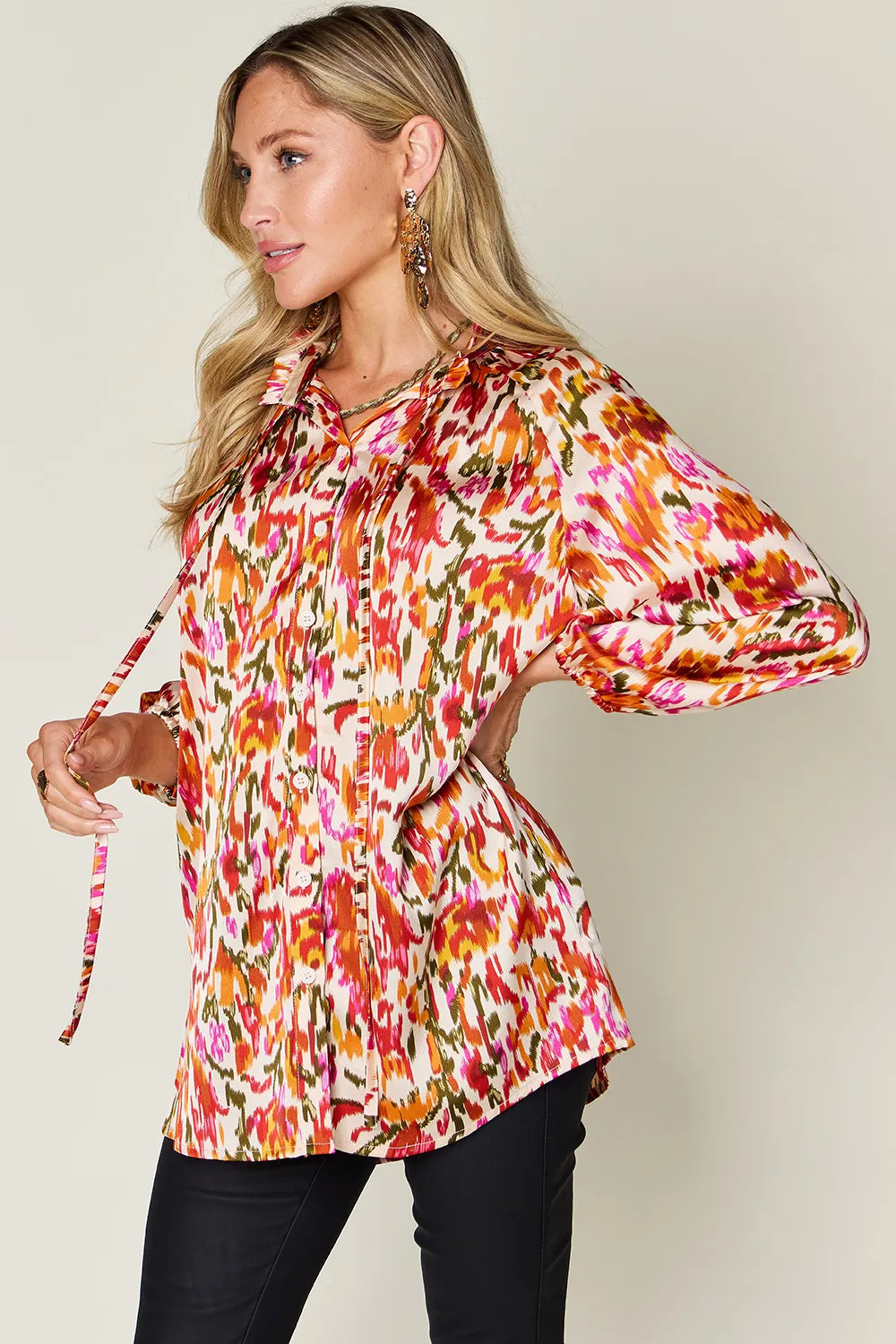 Abstract print button-up shirt with tie neck and long sleeves