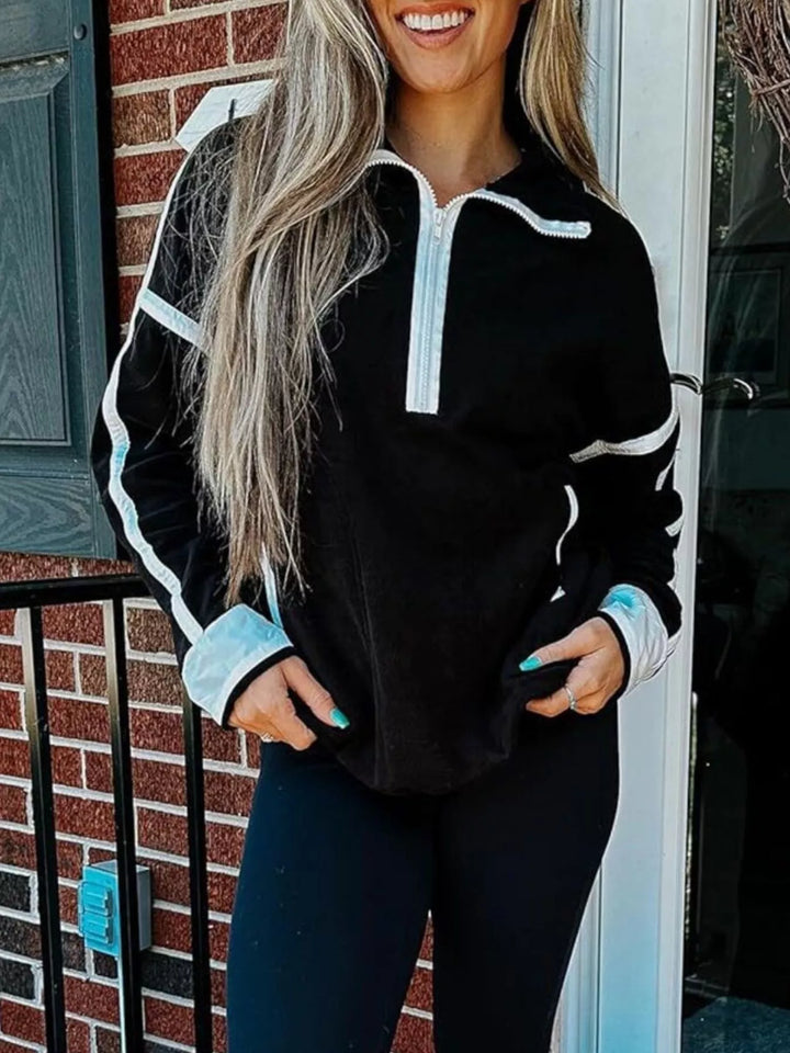 Half-zip fleece pullover with contrast trim and zip pockets