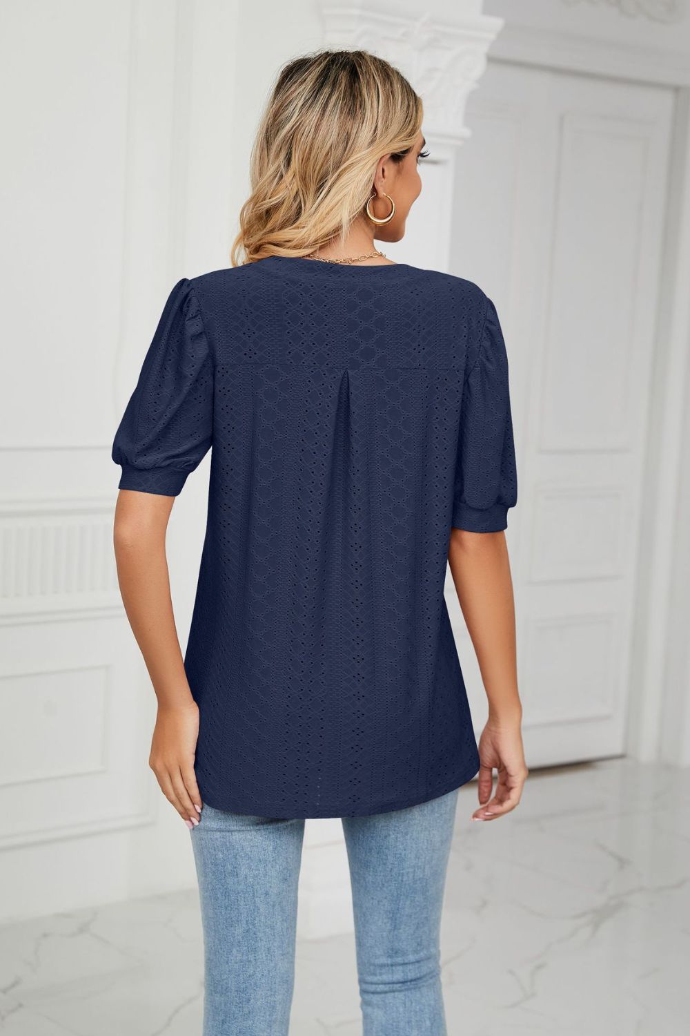 Eyelet puff sleeve top with notched V-neck
