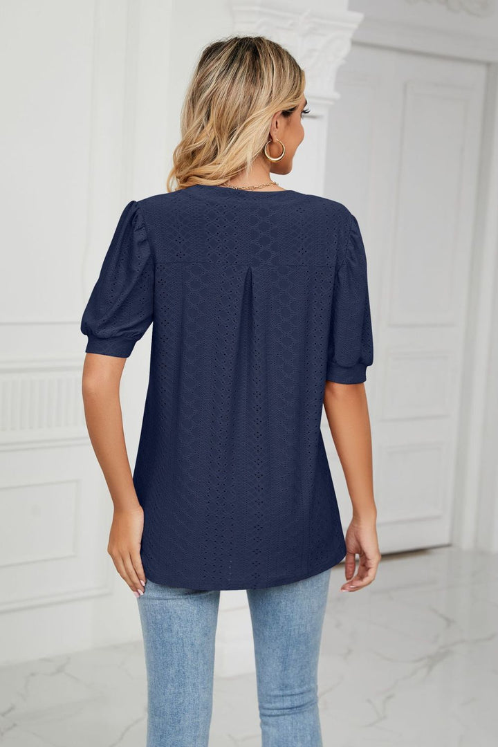 Eyelet puff sleeve top with notched V-neck