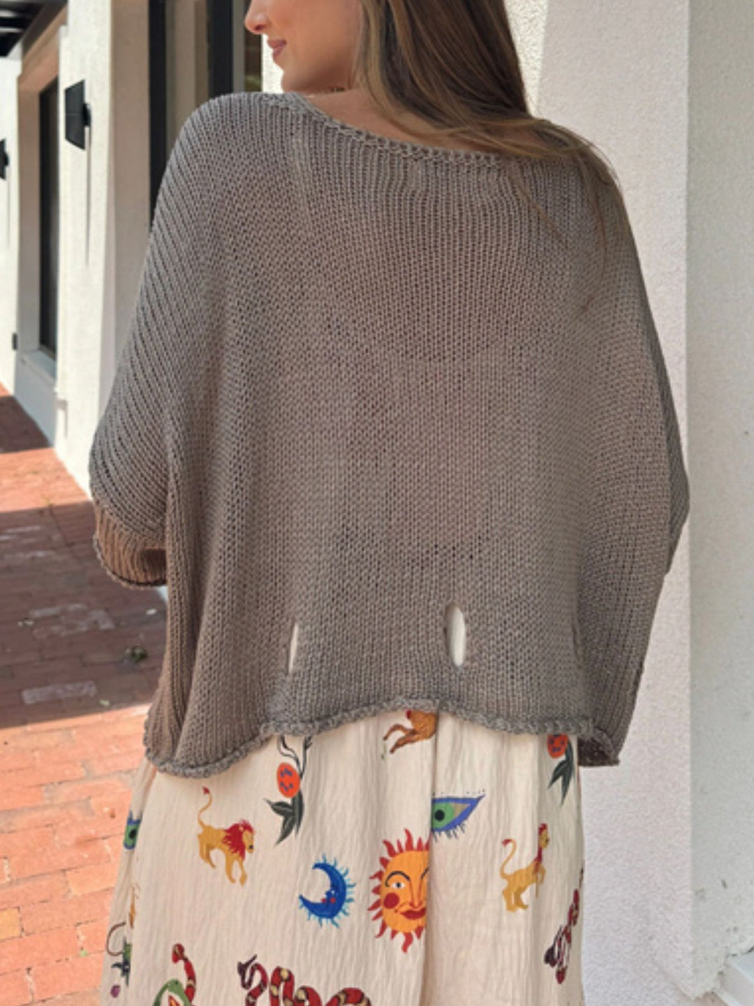 Distressed open-knit V-neck sweater with 3/4 sleeves