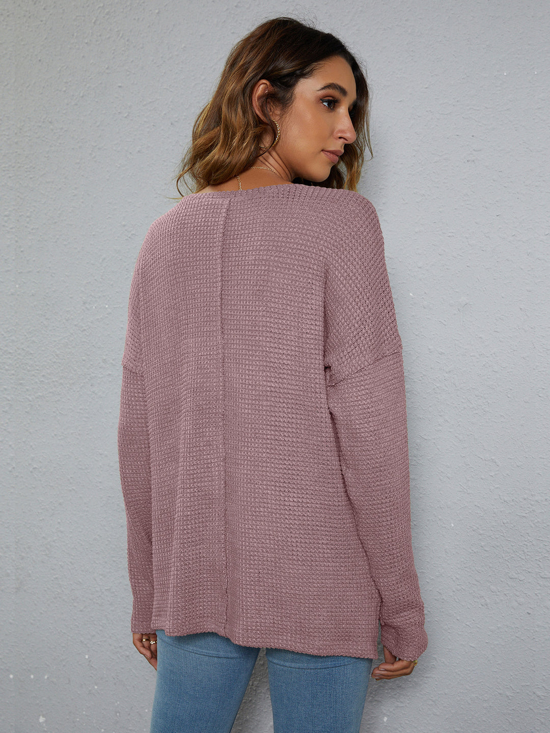 Dropped-shoulder waffle-knit V-neck top with high-low hem