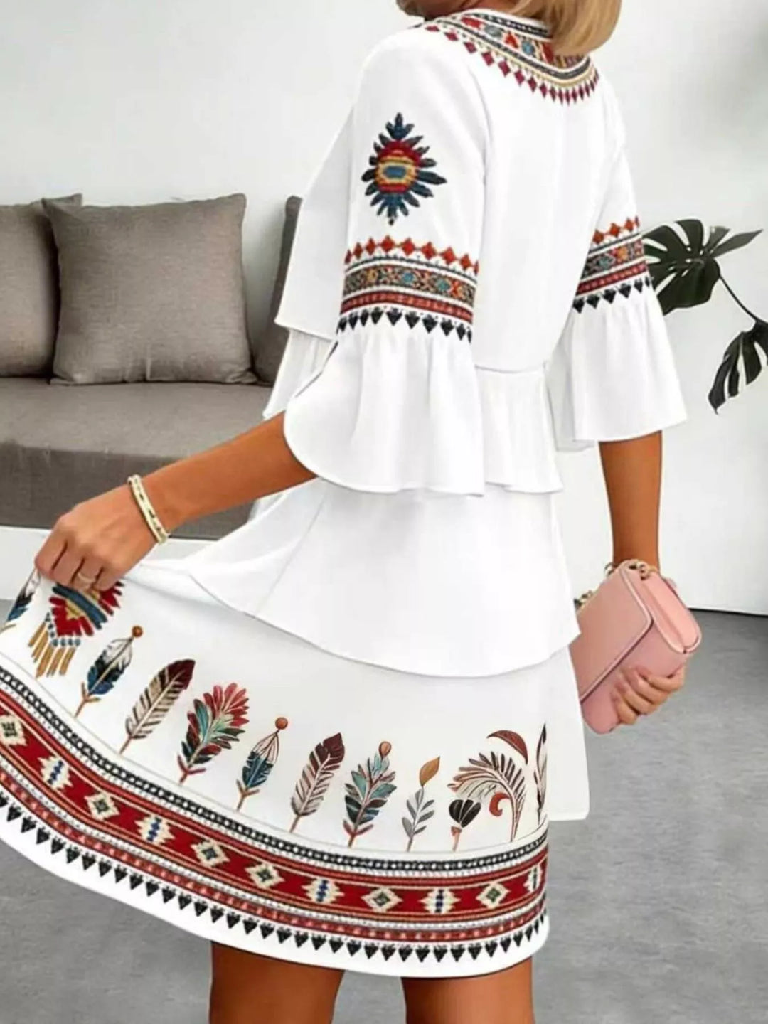 Tribal print tiered ruffle mini dress with notched neckline