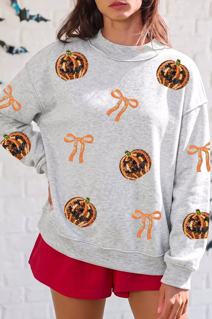 Sequin pumpkin and bow exposed seam Halloween sweatshirt