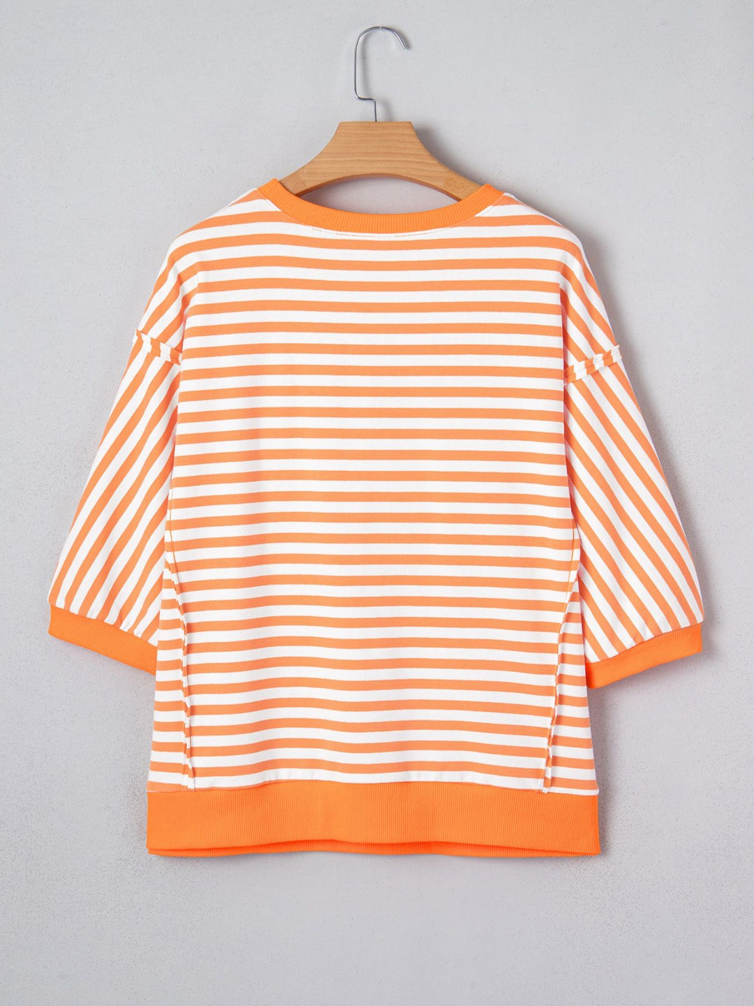 Striped exposed-seam 3/4 sleeve pullover top