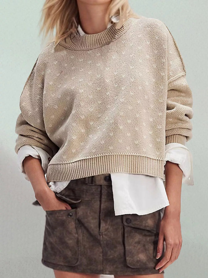 Dropped shoulder knit sweater with ribbed trim and side slits