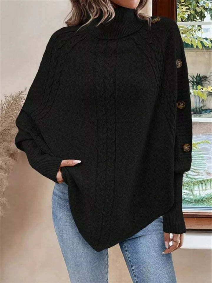 Cable knit turtleneck cape sweater with button shoulder