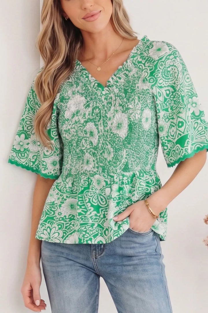 Gum Leaf Smocked V-neck floral peplum blouse with flutter sleeves