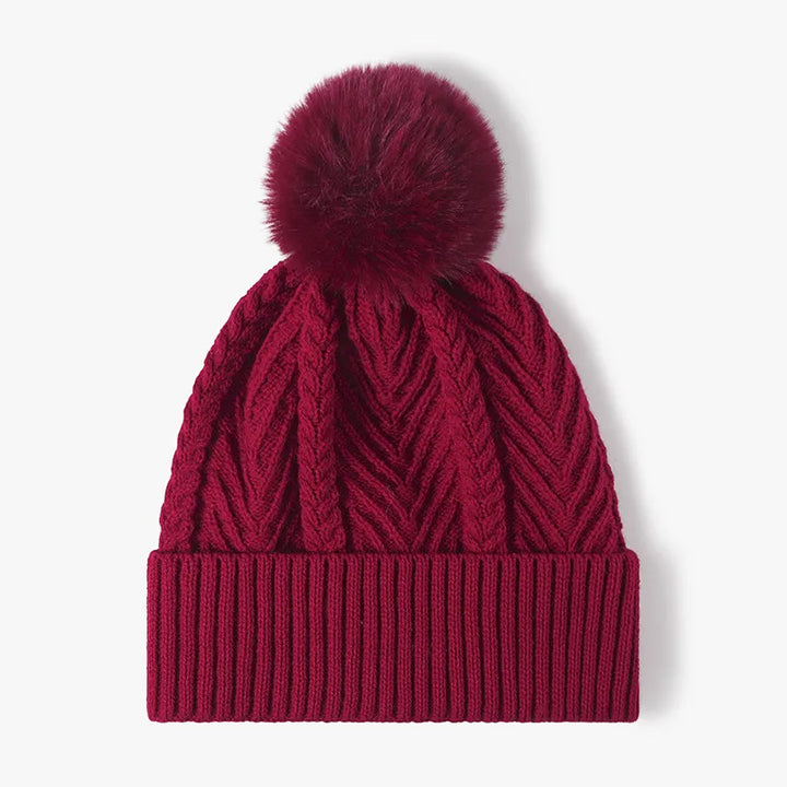 Burgundy Cable knit beanie with faux fur pompom and ribbed cuff