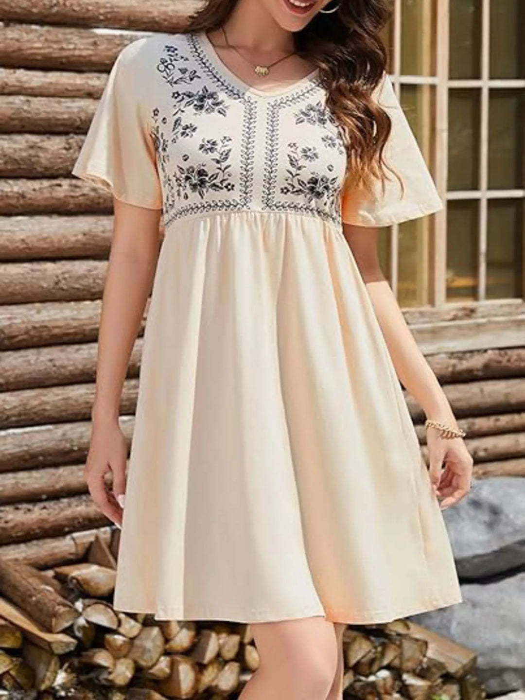 Floral embroidered v-neck babydoll mini dress