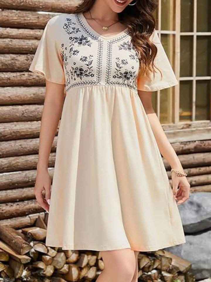 Floral embroidered v-neck babydoll mini dress