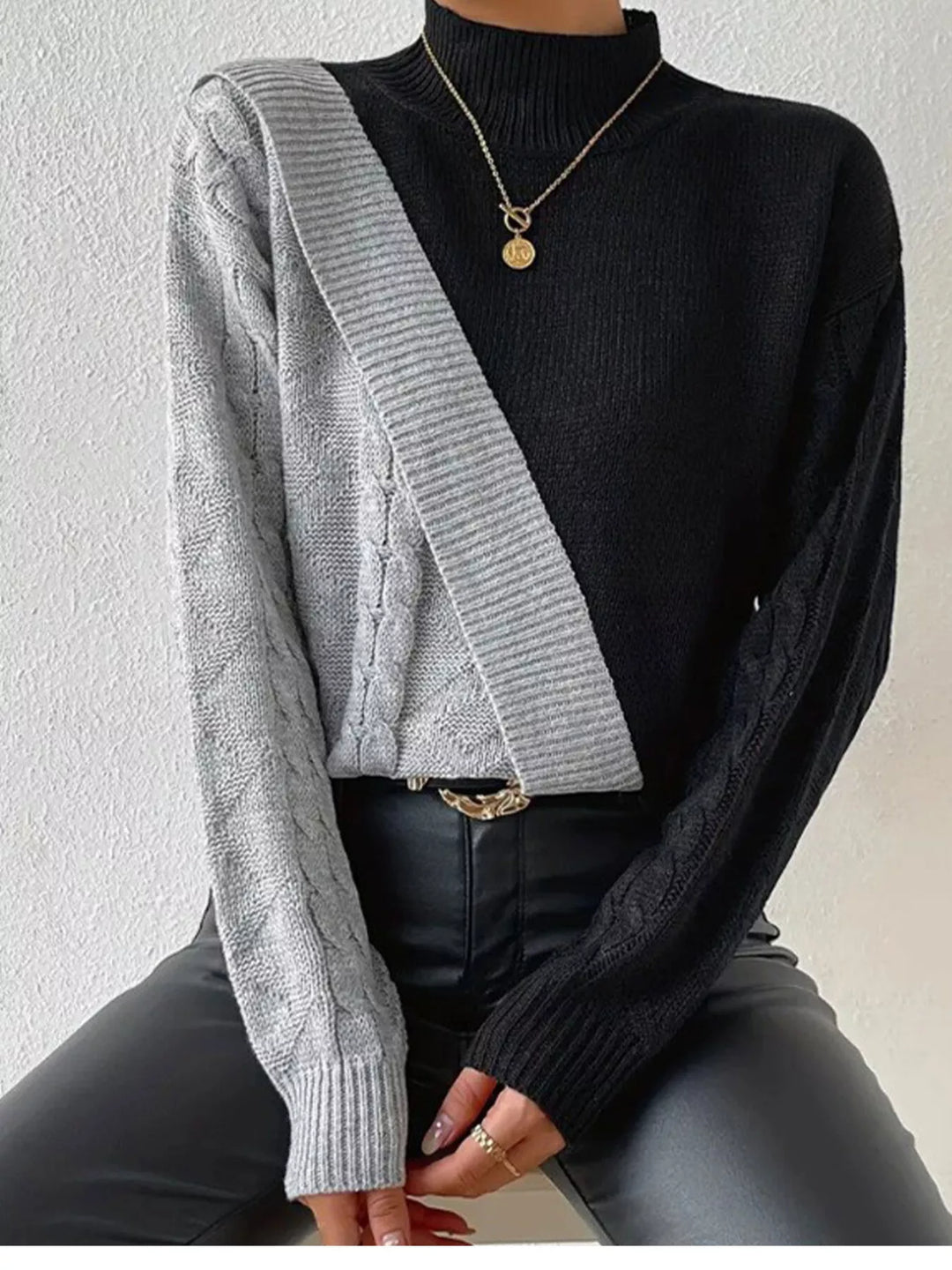 Diagonal color block cable knit mock neck sweater