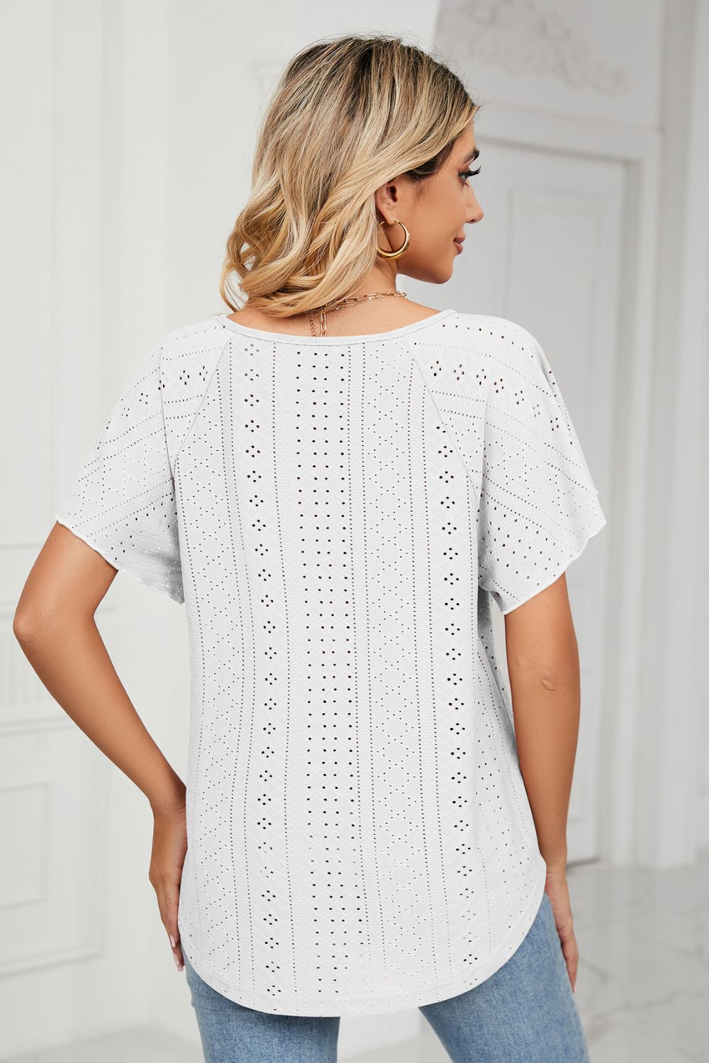 Eyelet flutter sleeve top with V-neck tie