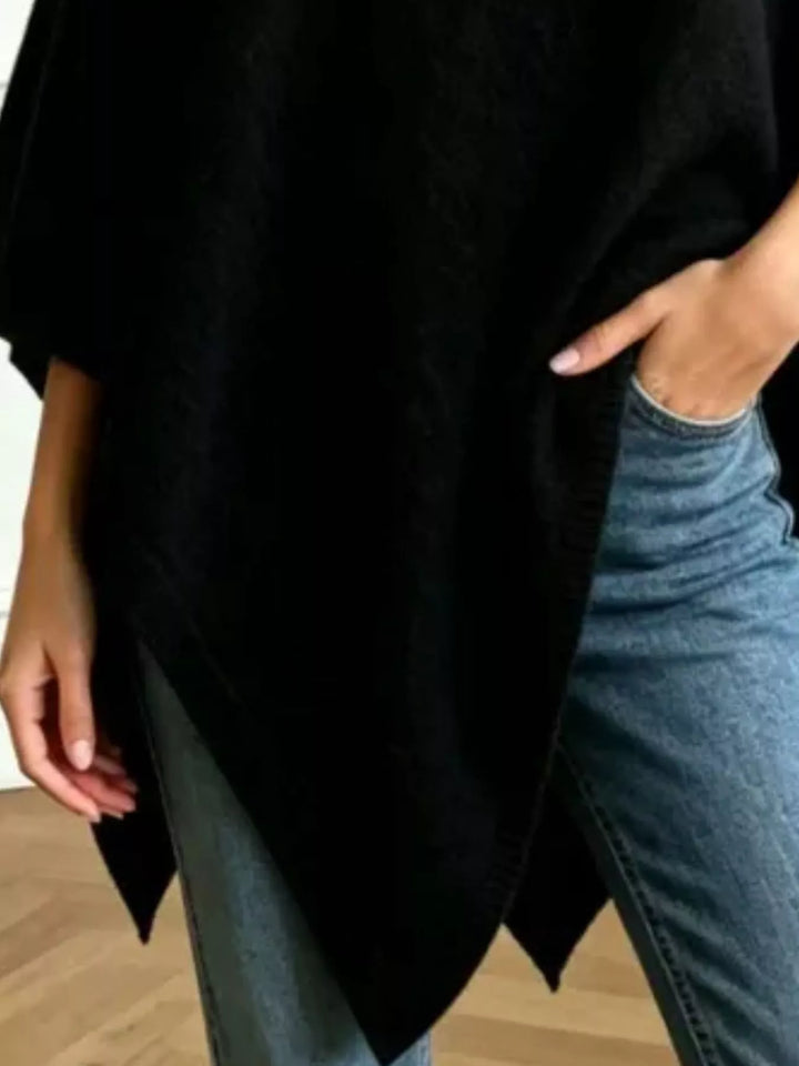 Asymmetrical hem textured knit poncho with ribbed crew neck