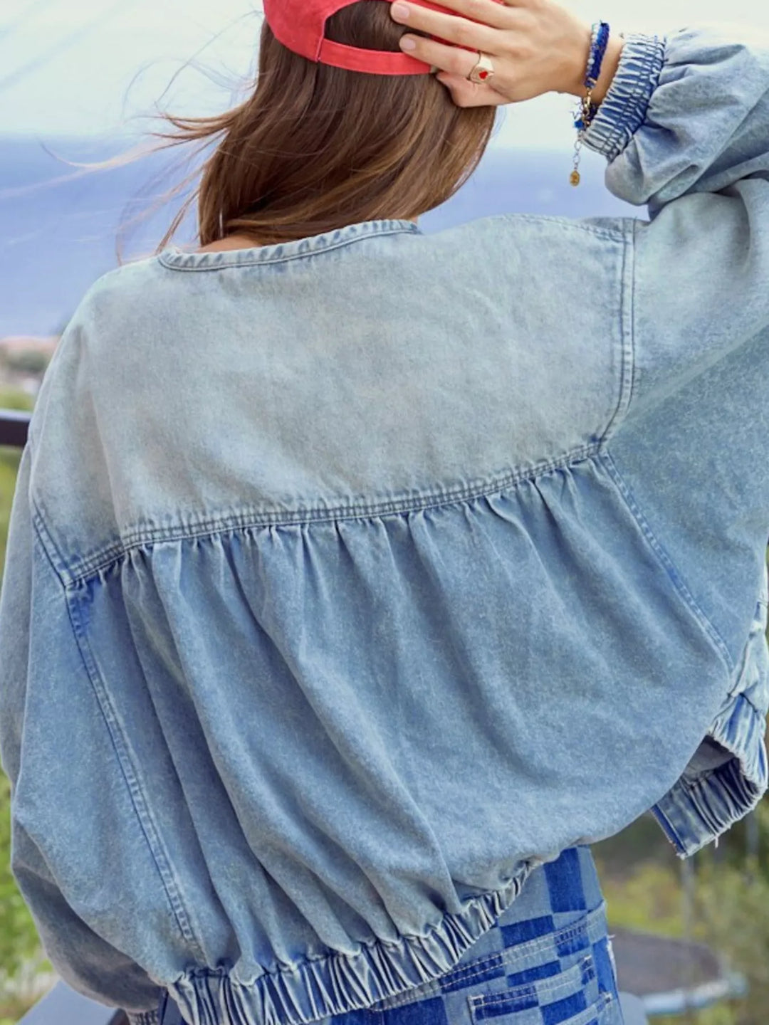 Washed denim zip-up jacket with drawstring hem