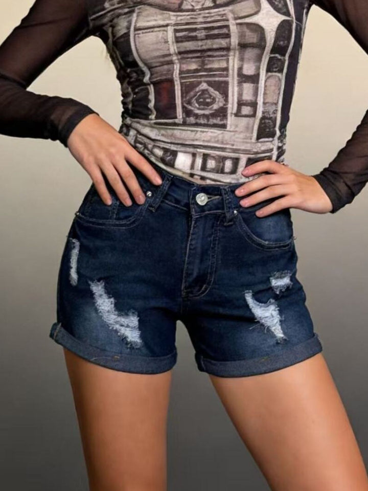Distressed mid-rise denim shorts with cuffed hem
