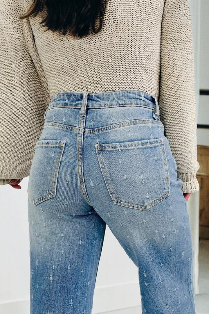 Distressed wide-leg jeans with tummy control and raw hem