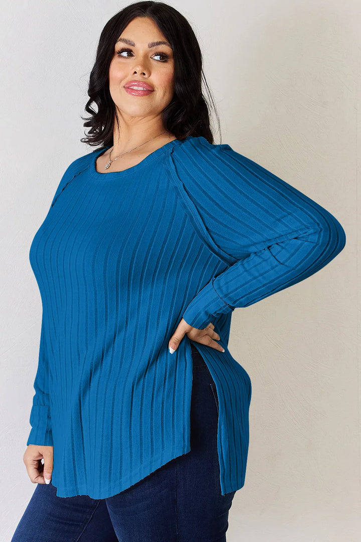 Ribbed knit round neck long sleeve top with side slits